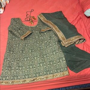 This gorgeous sage green 3 piece punjabi suit was handmade in India